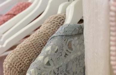 clothes hanging on white rack