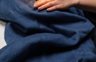 a person using a sewing machine