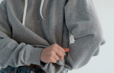 stylish woman wearing gray hoodie